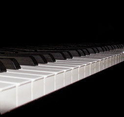 White piano keys on black background
