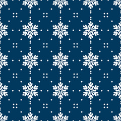 Christmas holidays seamless pattern of snowflakes and tiny dots on blue background. Design for winter holiday, Xmas and New Year. Vector illustration.