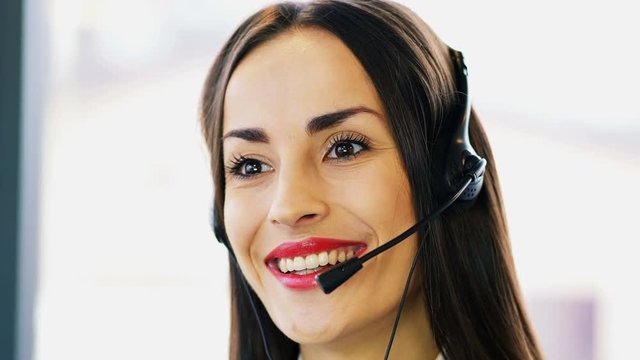 4K.Woman operator in customer support service center. Close up face