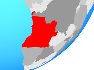 Fototapeta premium Angola on blue political globe.