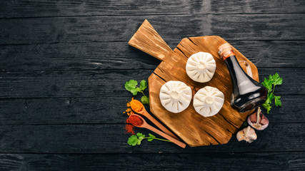 Georgian homemade food called khinkali. Georgian cuisine. On the old wooden background. Free space for text. Top view.