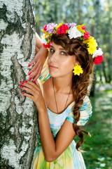 Beauty portrait of woman with flower wreath