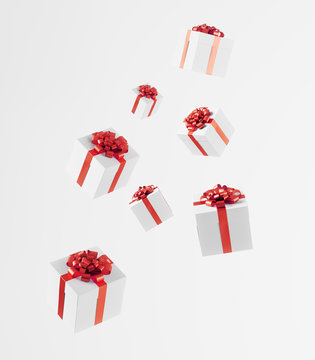 Lots of flying gift boxes with red bow on white background. 3d rendering