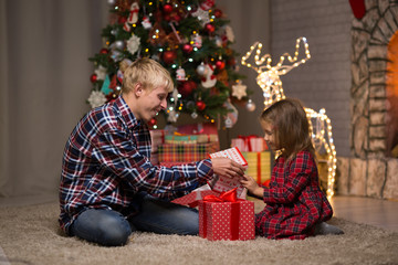 Fototapeta na wymiar Children celebrates Christmas at home