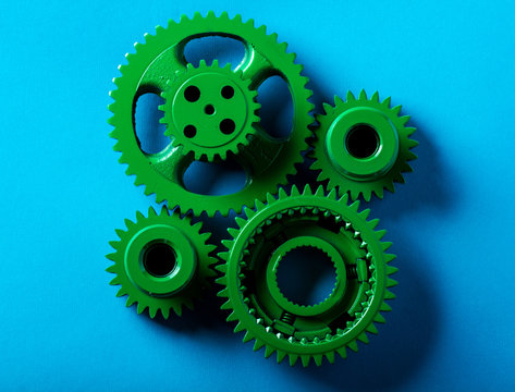 gears mechanism green bright technology blue background

