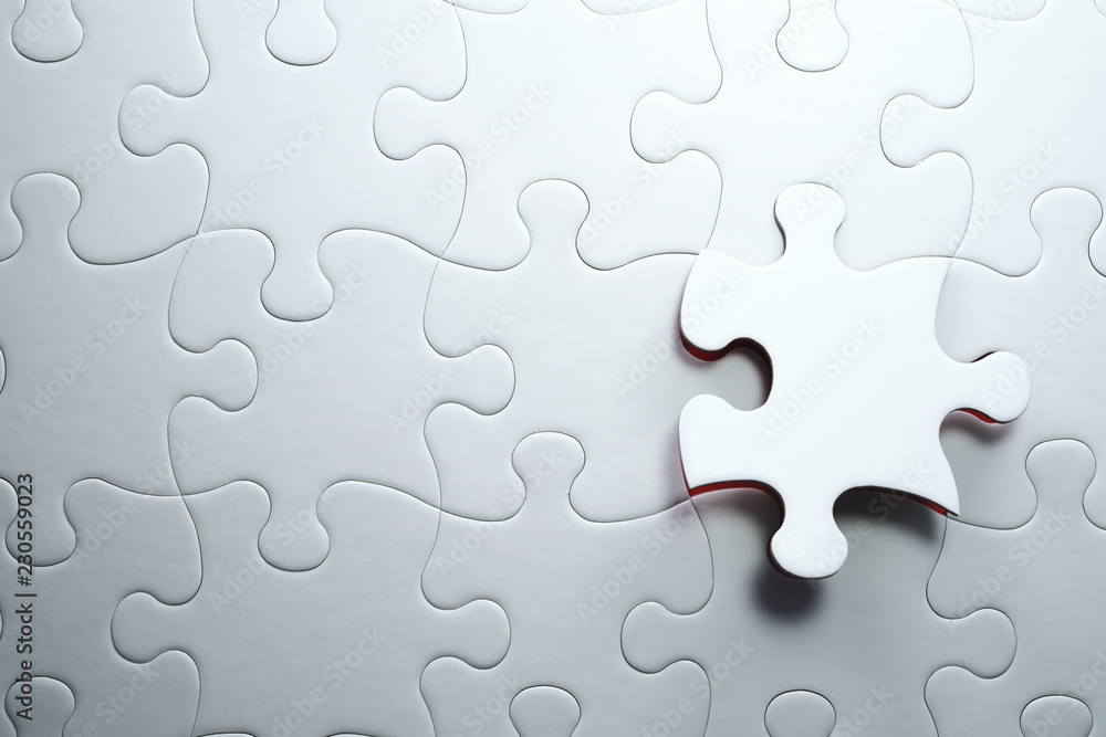 Poster Last piece of jigsaw puzzle. Solving and completing the task.The correct solution. Assembling white jigsaw puzzle pieces.