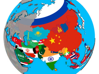 Asia with embedded national flags on blue political 3D globe.