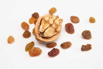 Walnut and raisins isolated on white background