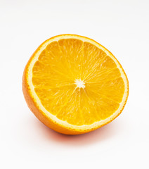 Ripe orange cut in half close-up