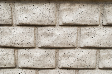 Gray horizontal concrete wall textured for brick close-up