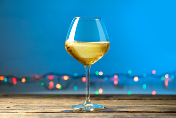 Glasses of white wine on wooden table