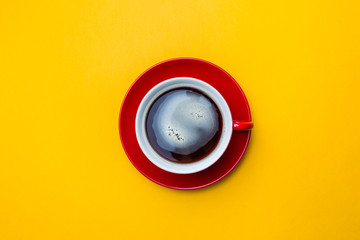 Coffe cup on yellow