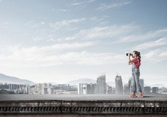 Naklejka premium Concept of careless happy childhood with girl of school age look