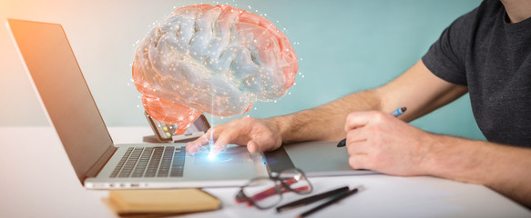 Graphic designer using digital 3D projection of a human brain 3D rendering