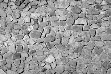 Old grungy brick wall surface in black and white.