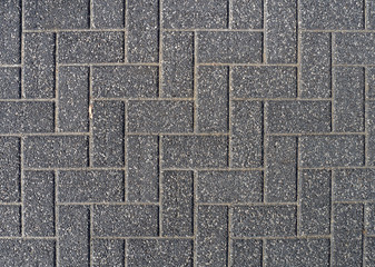 Background of gray cobblestone pavement.