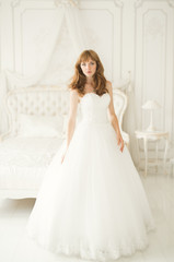 Fototapeta premium Beautiful luxury bride in elegant white dress