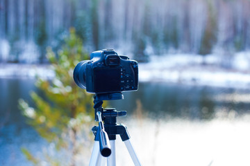 camera on a tripod, shooting landscapes