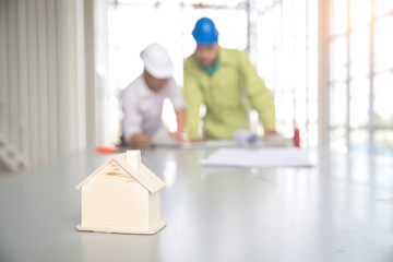 engineer people working and discussing with architecture or blueprint at construction site