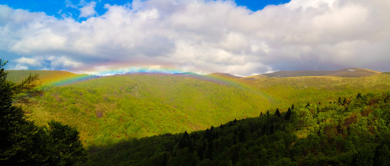 Landscape of Mavrovo national park with rainbow, mountain and lake, FYR Macedonia