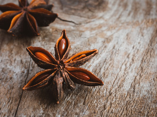 Star anise against a wooden background