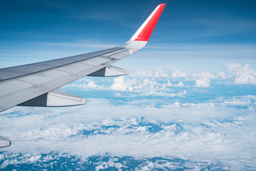 Beautiful view from airplane window and blue sky on nice sunny day, This time in altitude during flight.
