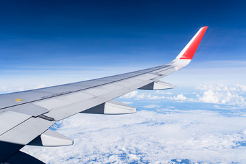 Beautiful view from airplane window and blue sky on nice sunny day, This time in altitude during flight.