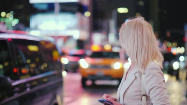 Woman stops famous yellow cab in Times Square