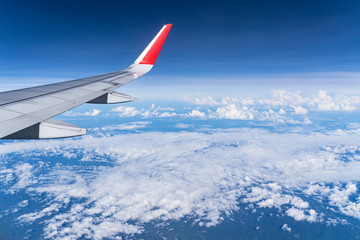 Obraz premium Beautiful view from airplane window and blue sky on nice sunny day, This time in altitude during flight.