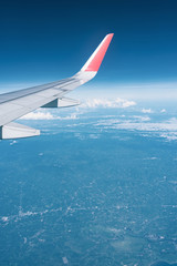 Fototapeta premium Beautiful view from airplane window and blue sky on nice sunny day, This time in altitude during flight.