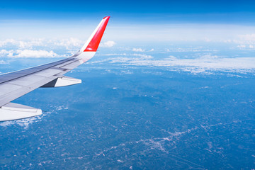 Fototapeta premium Beautiful view from airplane window and blue sky on nice sunny day, This time in altitude during flight.