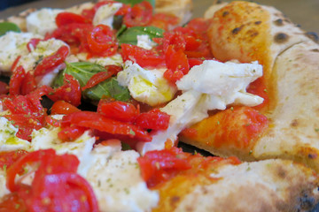 Italian food in Toscana: Pizza with basil, fresh buffalo mozzarella and tomatoes