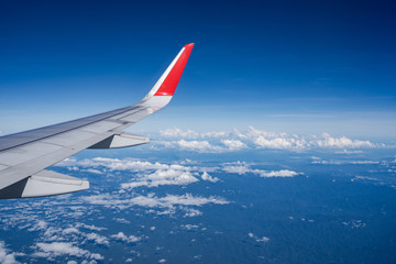 Obraz premium Beautiful view from airplane window and blue sky on nice sunny day, This time in altitude during flight.