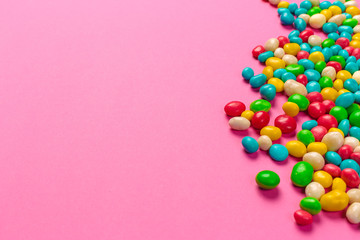 Colorful lollipops on a pink background