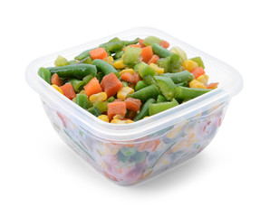 Plastic container with frozen vegetables on white background