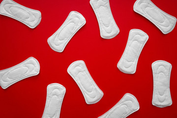 Menstrual pads on color background, top view