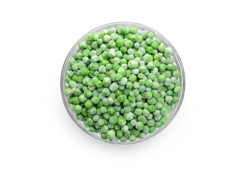 Bowl with frozen green peas on white background