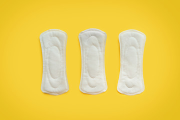 Menstrual pads on color background