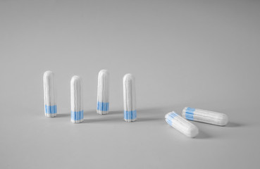 Tampons on grey background