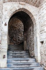 Fototapeta na wymiar Medieval arch with steps