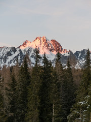 Sunset on the snow mountains. Sunset, mountains and snow. Sunset in High Tatras.