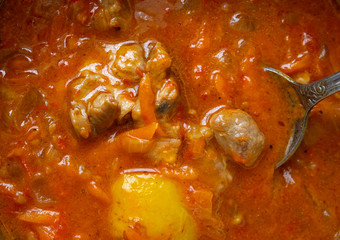 Goulash - highly-seasoned Hungarian dish of meat and vegetable closeup