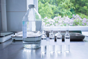 vials and ampoules with medicine on the medical table