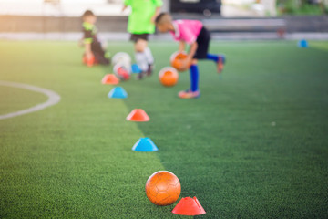 Soccer player jump and stomp for training to trap and control football.