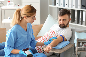 Fototapeta premium Man donating blood in hospital