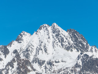 Obraz premium Snow mountains. Panorama of High Tatras. Snow mountains and blue sky.