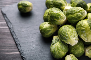 Fototapeta premium Fresh brussels sprouts on slate plate, closeup