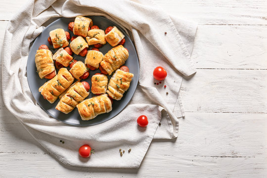 Delicious sausage rolls on wooden table - Powered by Adobe