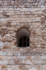 Fototapeta na wymiar Arc window on ancient facade in Old Town Jerusalem Israel