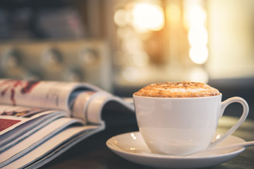 Latte coffee or coffe on the table of cafe in the morning  